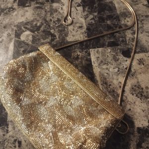 Gold and silver beaded clutch